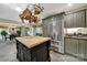 A kitchen boasts a stainless steel fridge, an island with a butcher block top, and hanging copper pots at 4 Hummingbird Ct, Clover, SC 29710
