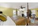 Well-lit main bedroom features hardwood floors, four-poster bed, sitting area, and ensuite bathroom at 4 Hummingbird Ct, Clover, SC 29710