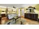 This main bedroom features hardwood floors, a sitting area, a four-poster bed, and ample natural light at 4 Hummingbird Ct, Clover, SC 29710
