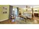 A spacious bedroom offers hardwood floors, sitting area, and access to an outdoor deck at 4 Hummingbird Ct, Clover, SC 29710