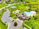 Beautiful aerial view of community amenities including the clubhouse, pool, tennis courts, and playground at 405 Five Leaf Ln, Waxhaw, NC 28173