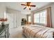 Inviting bedroom featuring a ceiling fan and a dedicated workspace area at 405 Five Leaf Ln, Waxhaw, NC 28173