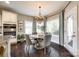 Cozy dining area with a round table, chandelier lighting, large windows, and access to the backyard at 405 Five Leaf Ln, Waxhaw, NC 28173