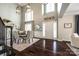 Bright dining area with tall ceilings, large windows, and elegant lighting fixtures at 405 Five Leaf Ln, Waxhaw, NC 28173