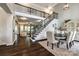 Elegant foyer with hardwood floors, a staircase with iron railings, and an open view to the living area at 405 Five Leaf Ln, Waxhaw, NC 28173