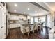 Modern kitchen with granite countertops, stainless steel appliances, white cabinets, and a spacious center island at 405 Five Leaf Ln, Waxhaw, NC 28173