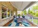 Covered patio with dining set, string lights, and view of the backyard at 405 Five Leaf Ln, Waxhaw, NC 28173