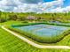 Aerial view of tennis courts, clubhouse, and playground in this desirable neighborhood at 405 Five Leaf Ln, Waxhaw, NC 28173