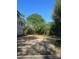 The property lot features partial construction and tree coverage under a clear, blue sky at 4105 Walker Rd, Charlotte, NC 28211
