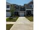 New construction townhome features a one-car garage, neutral paint, and manicured landscaping at 4305 Summit Woods Dr, Charlotte, NC 28216