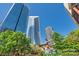 Scenic view of skyscrapers from community green space with manicured trees and plants at 435 S Tryon St, Charlotte, NC 28202
