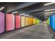 A vibrant corridor showcasing a spectrum of colors and modern design elements for a unique and inviting atmosphere at 435 S Tryon St, Charlotte, NC 28202