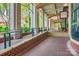 Inviting walkway with brick pavers, columns, and natural light, leading to shops at 435 S Tryon St, Charlotte, NC 28202