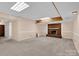 Large basement rec room with brick fireplace and recessed lighting at 4405 3Rd Nw St, Hickory, NC 28601