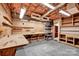 Spacious basement workshop with pegboard, shelves, cabinets, and work benches at 4405 3Rd Nw St, Hickory, NC 28601
