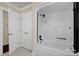 Bathroom with full tub and shower, and linen closet at 4405 3Rd Nw St, Hickory, NC 28601