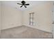 Neutral bedroom with ceiling fan and a window offering natural light, creating a relaxing atmosphere at 4405 3Rd Nw St, Hickory, NC 28601