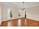 Dining room with hardwood floors and natural light, creating an inviting space for meals and gatherings at 4405 3Rd Nw St, Hickory, NC 28601