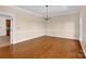 Bright dining room with hardwood floors, chair rail, and elegant chandelier, perfect for formal dining at 4405 3Rd Nw St, Hickory, NC 28601
