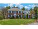 Traditional two-story brick home with a manicured lawn and symmetrical design, accented by dark green shutters at 4405 3Rd Nw St, Hickory, NC 28601