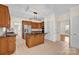 Kitchen features an island with cooktop, stainless steel refrigerator, and wood cabinetry at 4405 3Rd Nw St, Hickory, NC 28601