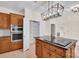 Kitchen featuring wood cabinetry, stainless oven, and a pantry at 4405 3Rd Nw St, Hickory, NC 28601