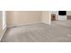 Spacious living room with neutral carpet and ample natural light at 4405 3Rd Nw St, Hickory, NC 28601