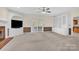Cozy living room featuring built-in shelving, brick fireplace, and sliding doors at 4405 3Rd Nw St, Hickory, NC 28601