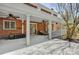 Expansive covered patio with brick facade and white columns, ideal for outdoor living and entertaining at 4405 3Rd Nw St, Hickory, NC 28601