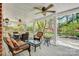 Covered porch with outdoor furniture and ceiling fans at 4405 3Rd Nw St, Hickory, NC 28601