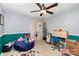 Bedroom featuring ceiling fan, carpet floors, and blue accent wall at 4813 Carving Tree Dr, Mint Hill, NC 28227