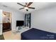 Bedroom featuring ceiling fan, carpet floors, and a TV at 4813 Carving Tree Dr, Mint Hill, NC 28227