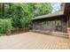 Exterior of home featuring a wood deck, brick accents, and a screened-in porch at 4813 Carving Tree Dr, Mint Hill, NC 28227