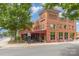 Vinther's Hill building exterior with brick facade, outdoor seating, and street view at 4813 Carving Tree Dr, Mint Hill, NC 28227