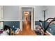 Long hallway featuring hardwood floors and gray walls at 4813 Carving Tree Dr, Mint Hill, NC 28227