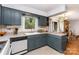 Well-lit kitchen features a corner sink, neutral countertops and ample cabinet space at 4813 Carving Tree Dr, Mint Hill, NC 28227