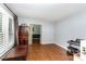 Bright living room featuring hardwood floors and decorative wood storage chest at 4813 Carving Tree Dr, Mint Hill, NC 28227