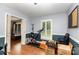 Spacious living room with decorative wainscoting and hardwood floors at 4813 Carving Tree Dr, Mint Hill, NC 28227
