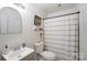 Well-lit bathroom with shower/bath and sink with neutral colors at 4816 Spring Lake Dr # B, Charlotte, NC 28212