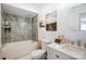Well-lit bathroom with stylish tile, a bathtub and a modern vanity at 4816 Spring Lake Dr # B, Charlotte, NC 28212