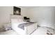 Bedroom featuring a queen bed, large window, and workstation at 4816 Spring Lake Dr # B, Charlotte, NC 28212