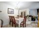 Charming dining room featuring a chandelier, wood table, and a view of the living room through double doors at 4816 Spring Lake Dr # B, Charlotte, NC 28212