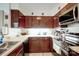 Functional kitchen with stainless steel appliances, ample cabinetry, and countertops for efficient cooking at 4816 Spring Lake Dr # B, Charlotte, NC 28212