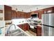 Well-equipped kitchen showcasing stainless steel appliances, plenty of cabinets, and countertops at 4816 Spring Lake Dr # B, Charlotte, NC 28212