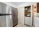 Well-organized laundry area with a washer, dryer, storage cabinets and a refrigerator for added convenience at 4816 Spring Lake Dr # B, Charlotte, NC 28212