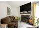 Inviting living room with a fireplace, TV, and stylish decor that complement the cozy atmosphere at 4816 Spring Lake Dr # B, Charlotte, NC 28212