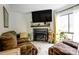 Comfortable living room featuring a fireplace, TV, and neutral color scheme creating a cozy atmosphere at 4816 Spring Lake Dr # B, Charlotte, NC 28212
