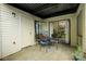 Relax on the covered patio with a table and chairs, accessible through sliding glass doors at 4816 Spring Lake Dr # B, Charlotte, NC 28212
