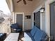 Relaxing outdoor balcony furnished with comfortable seating, offering a private space for leisure and entertainment at 5007 Sharon Rd # R, Charlotte, NC 28210