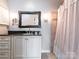 Bathroom featuring a vanity, framed mirror, and shower with a curtain at 5007 Sharon Rd # R, Charlotte, NC 28210